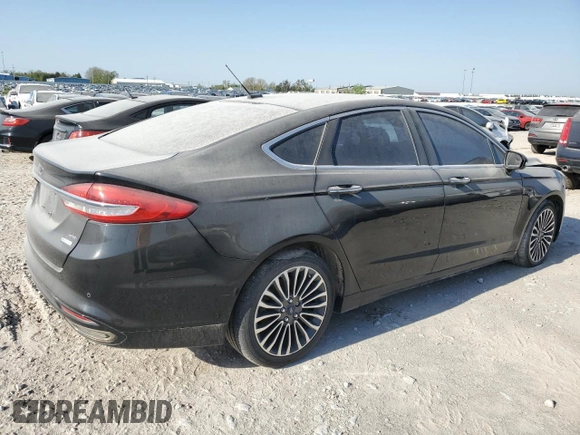 2017 Ford Fusion SE z VIN 3FA6P0H98HR179253, wystawiony jako Copart lot #52015345 z przebiegiem 99 883 mil mil oraz Czysty tytuł • Clean title. Historia ofert i sprzedaży dostępna na DreamBid. Obrazek 3.