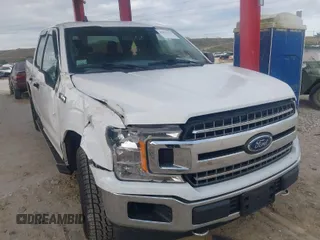 2019 Ford F-150 XL with VIN 1FTEW1E50KFA47687, listed as a IAAI auction lot 42021043 with 129,337 mi miles. Bid and sale history available at carsss.com. Image 1.