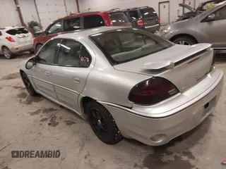 2004 Pontiac Grand Am GT with VIN 1G2NW52E04M617802, listed as a IAAI auction lot 41353209 with 103,716 mi miles. Bid and sale history available at carsss.com. Image 3.