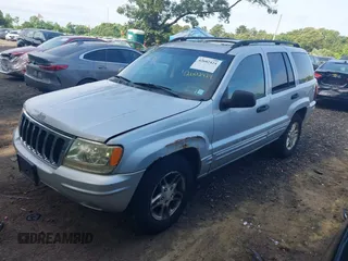 2002 Jeep Grand Cherokee Laredo z VIN 1J4GW48S62C261154, wystawiony jako IAAI lot #42602424 z przebiegiem 160 295 mil mil oraz . Historia ofert i sprzedaży dostępna na DreamBid. Obrazek 2.