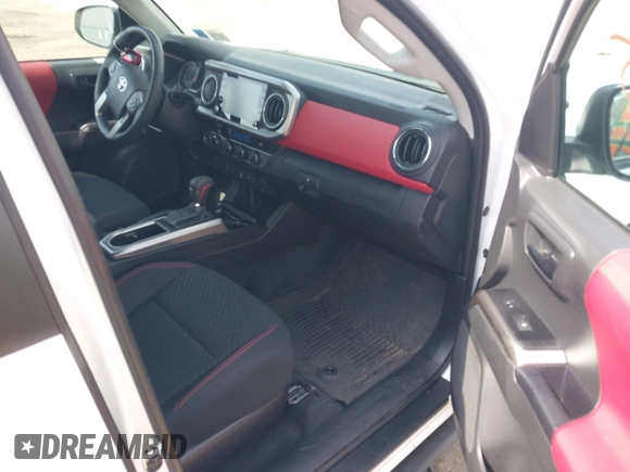 2023 Toyota Tacoma SR with VIN 3TMCZ5AN2PM642205, listed as a IAAI auction lot 42167945 with 10,595 mi miles and . Bid and sale history available at DreamBid. Image 5.