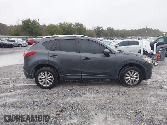 2015 Mazda CX-5 Touring with VIN JM3KE2CY4F0435563, listed as a IAAI auction lot 41311988 with 187,183 mi miles. Bid and sale history available at carsss.com. Image 13.