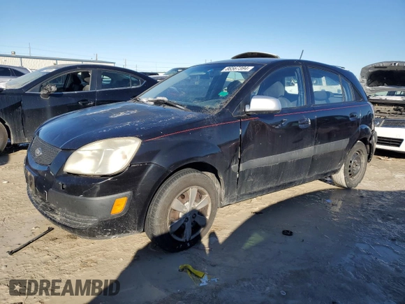 2009 Kia Rio LX with VIN KNADE243796516902, listed as a Copart auction lot 86567394 with 304,684 mi miles and Salvage Title. Bid and sale history available at carsss.com. Image 1.