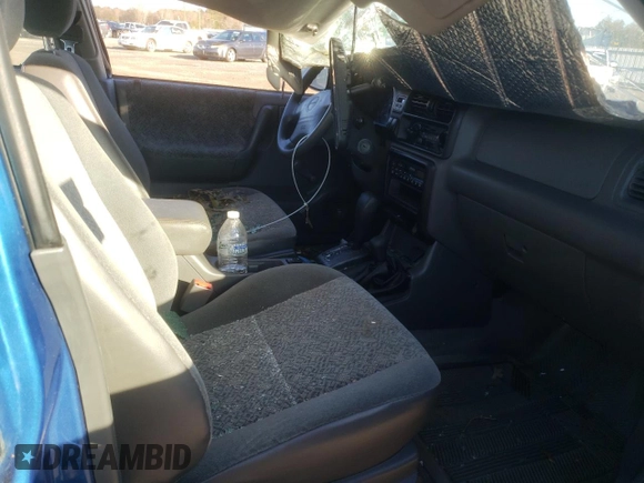 2001 Isuzu Rodeo S with VIN 4S2DM58WX14301336, listed as a Copart auction lot 77770164 with Not provided miles and Salvage title. Bid and sale history available at DreamBid. Image 7.