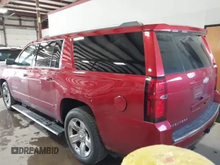 2015 Chevrolet Suburban LTZ z VIN 1GNSKKKC7FR218034, wystawiony jako IAAI lot #41884644 z przebiegiem 160 721 mil mil oraz . Historia ofert i sprzedaży dostępna na DreamBid. Obrazek 3.