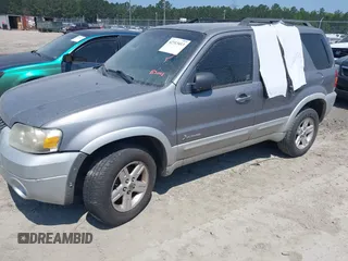2007 Ford Escape Hybrid with VIN 1FMCU49H87KB34041, listed as a IAAI auction lot 42313413 with Not provided miles and . Bid and sale history available at DreamBid. Image 2.