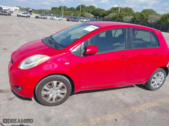 2010 Toyota Yaris with VIN JTDKT4K31A5318034, listed as a IAAI auction lot 41322096 with 114,817 mi miles. Bid and sale history available at carsss.com. Image 13.