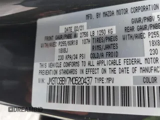 2021 Mazda CX-9 Sport with VIN JM3TCBBY7M0520437, listed as a IAAI auction lot 42022562 with 77,063 mi miles and . Bid and sale history available at DreamBid. Image 9.