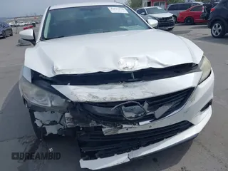 2016 Mazda Mazda6 i Touring with VIN JM1GJ1V57G1429887, listed as a IAAI auction lot 42029170 with 140,519 mi miles. Bid and sale history available at carsss.com. Image 6.