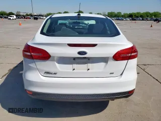 2018 Ford Focus SE z VIN 1FADP3F29JL225126, wystawiony jako Copart lot #52817265 z przebiegiem Nie podano mil oraz Szkoda całkowita • Salvage title. Historia ofert i sprzedaży dostępna na DreamBid. Obrazek 6.