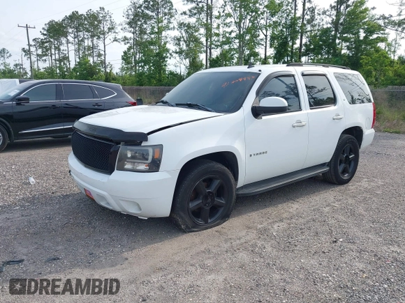2007 Chevrolet Tahoe LS with VIN 1GNFC13J97R109226, listed as a IAAI auction lot 42304983 with 348,630 mi miles and . Bid and sale history available at DreamBid. Image 2.