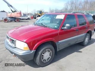 1998 GMC Jimmy SLT with VIN 1GKDT13W1W2521468, listed as a IAAI auction lot 41819921 with 161,931 mi miles. Bid and sale history available at carsss.com. Image 2.