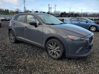 2017 Mazda CX-3 Touring with VIN JM1DKFC74H0176455, listed as a Copart auction lot 48825935 with 90,486 mi miles and Salvage Title. Bid and sale history available at carsss.com. Image 4.