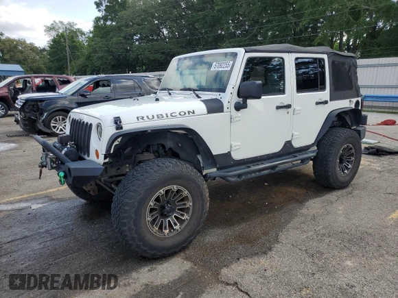 2010 Jeep Wrangler Unlimited Rubicon with VIN 1J4BA6H10AL176014, listed as a Copart auction lot 57092255 with 138,253 mi miles and Salvage title. Bid and sale history available at DreamBid. Image 1.