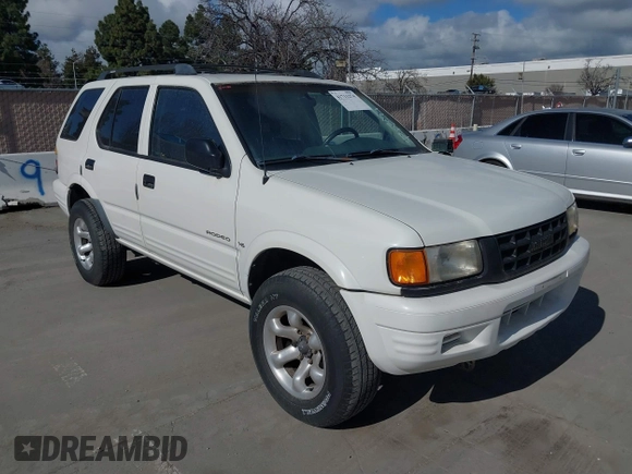 1998 Isuzu Rodeo S z VIN 4S2CK58W4W4308419, wystawiony jako IAAI lot #41711274 z przebiegiem 128 853 mil mil oraz . Historia ofert i sprzedaży dostępna na DreamBid. Obrazek 6.