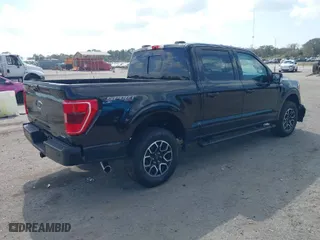 2023 Ford F-150 XL with VIN 1FTEW1EP3PKD05149, listed as a IAAI auction lot 41568543 with 5,594 mi miles. Bid and sale history available at carsss.com. Image 4.