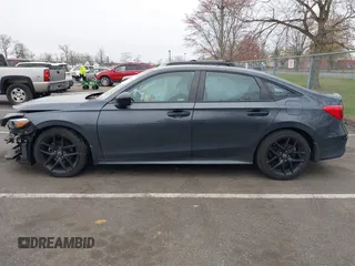 2022 Honda Civic Sport z VIN 2HGFE2F51NH597755, wystawiony jako IAAI lot #42006031 z przebiegiem 33 511 mil mil oraz . Historia ofert i sprzedaży dostępna na DreamBid. Obrazek 14.