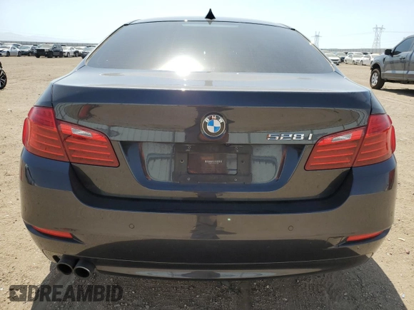 2016 BMW 5 Series 528i with VIN WBA5A5C51GG351554, listed as a Copart auction lot 61210265 with 73,968 mi miles and Salvage title. Bid and sale history available at DreamBid. Image 6.
