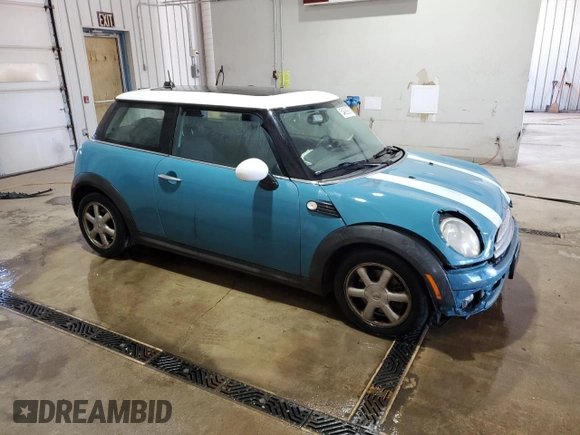 2009 MINI Hardtop with VIN WMWMF33569TW74610, listed as a Copart auction lot 54889805 with 147,533 mi miles and Salvage Title. Bid and sale history available at DreamBid. Image 4.