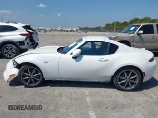 2021 Mazda MX-5 Miata Grand Touring z VIN JM1NDAM75M0450871, wystawiony jako IAAI lot #42060495 z przebiegiem 48 670 mil mil oraz . Historia ofert i sprzedaży dostępna na DreamBid. Obrazek 14.