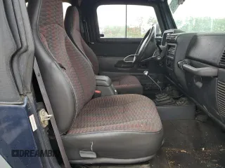 2000 Jeep Wrangler Sport z VIN 1J4FA49S1YP713523, wystawiony jako Copart lot #58076745 z przebiegiem 117 112 mil mil oraz Czysty tytuł • Clean title. Historia ofert i sprzedaży dostępna na DreamBid. Obrazek 10.