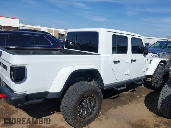 2021 Jeep Gladiator Rubicon with VIN 1C6JJTBG4ML536085, listed as a IAAI auction lot 41898204 with 39,627 mi miles and . Bid and sale history available at DreamBid. Image 13.
