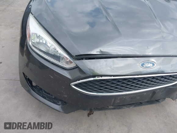 2018 Ford Focus SE with VIN 1FADP3F22JL295342, listed as a IAAI auction lot 42335881 with 77,464 mi miles and . Bid and sale history available at DreamBid. Image 6.