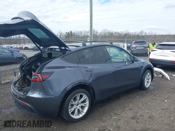 2023 Tesla Model Y Long Range with VIN 7SAYGDEE8PF599254, listed as a IAAI auction lot 41718342 with 24,339 mi miles and . Bid and sale history available at carsss.com. Image 4.
