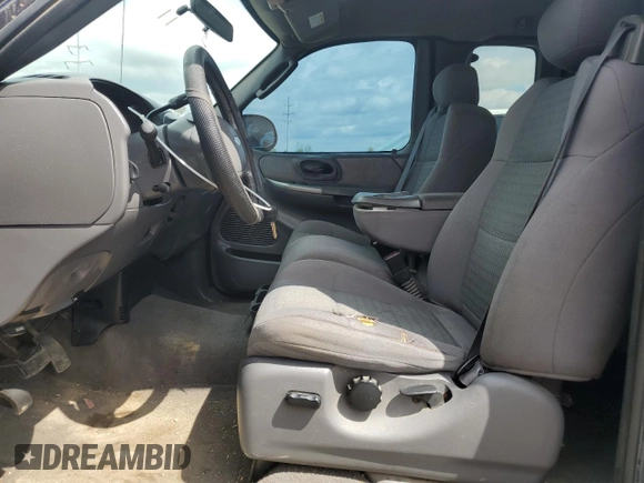 2003 Ford F-150 XL with VIN 2FTRX17WX3CB09775, listed as a Copart auction lot 56696415 with 226,460 mi miles and Salvage title. Bid and sale history available at DreamBid. Image 7.