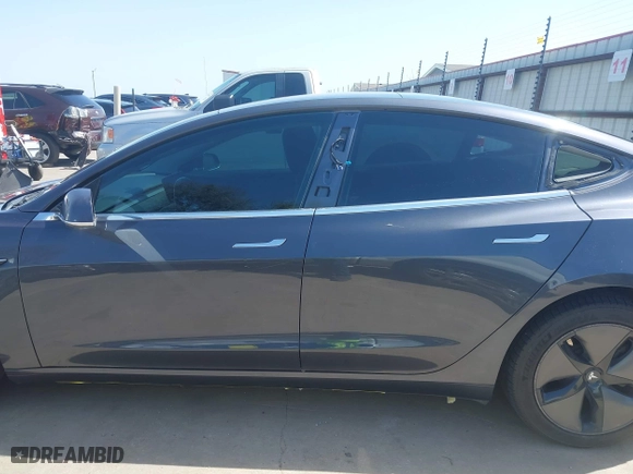 2018 Tesla Model 3 Long Range Battery with VIN 5YJ3E1EA4JF157782, listed as a IAAI auction lot 41774169 with 123,239 mi miles. Bid and sale history available at carsss.com. Image 15.