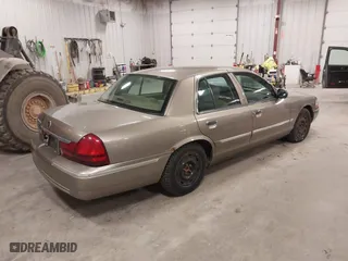 2004 Mercury Grand Marquis GS with VIN 2MEFM74W04X618043, listed as a IAAI auction lot 41985566 with 192,836 mi miles. Bid and sale history available at carsss.com. Image 4.