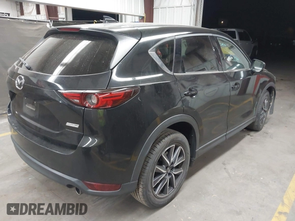 2018 Mazda CX-5 Grand Touring z VIN JM3KFADMXJ0311101, wystawiony jako IAAI lot #42163070 z przebiegiem 129 284 mil mil oraz . Historia ofert i sprzedaży dostępna na DreamBid. Obrazek 4.