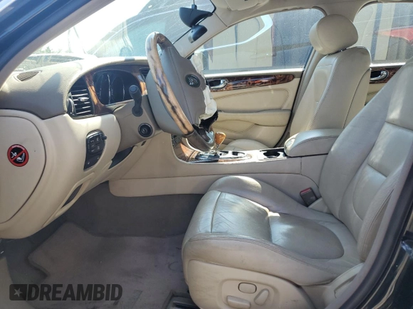 2004 Jaguar XJ with VIN SAJEA71C74SG02851, listed as a Copart auction lot 69056994 with 0 mi miles and Salvage Title. Bid and sale history available at carsss.com. Image 6.