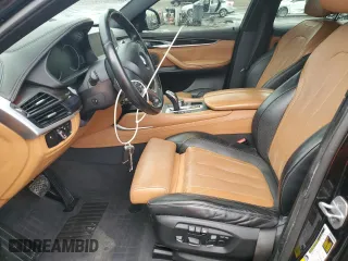 2017 BMW X6 sDrive35i with VIN 5UXKU0C36H0G69163, listed as a Copart auction lot 87044784 with 99,452 mi miles and Salvage Title. Bid and sale history available at carsss.com. Image 7.