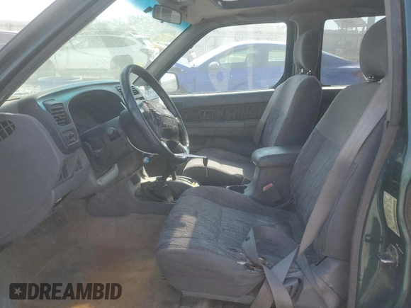 2000 Nissan Frontier XE with VIN 1N6ED27Y4YC382199, listed as a Copart auction lot 47127045 with 207,449 mi miles and Salvage title. Bid and sale history available at DreamBid. Image 7.