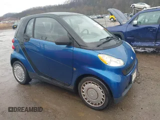 2009 Smart fortwo Pure with VIN WMEEJ31X69K312553, listed as a IAAI auction lot 41957660 with 156,476 mi miles. Bid and sale history available at carsss.com. Image 1.