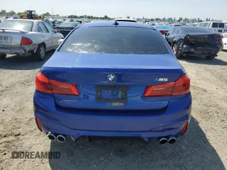 2018 BMW M5 z VIN WBSJF0C51JB282030, wystawiony jako Copart lot #54773835 z przebiegiem 44 046 mil mil oraz Szkody całkowita. Historia ofert i sprzedaży dostępna na DreamBid. Obrazek 6.