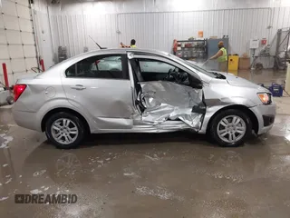 2014 Chevrolet Sonic LT with VIN 1G1JC5SG8E4107664, listed as a IAAI auction lot 41614306 with 128,946 mi miles and . Bid and sale history available at DreamBid. Image 13.