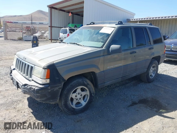 1997 Jeep Grand Cherokee Laredo with VIN 1J4GZ58S3VC603239, listed as a IAAI auction lot 42593915 with 295,696 mi miles and . Bid and sale history available at DreamBid. Image 2.