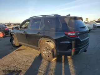 2025 Honda Pilot TrailSport with VIN 5FNYG1H65SB067792, listed as a Copart auction lot 87957615 with 4,470 mi miles and Salvage Title. Bid and sale history available at carsss.com. Image 2.