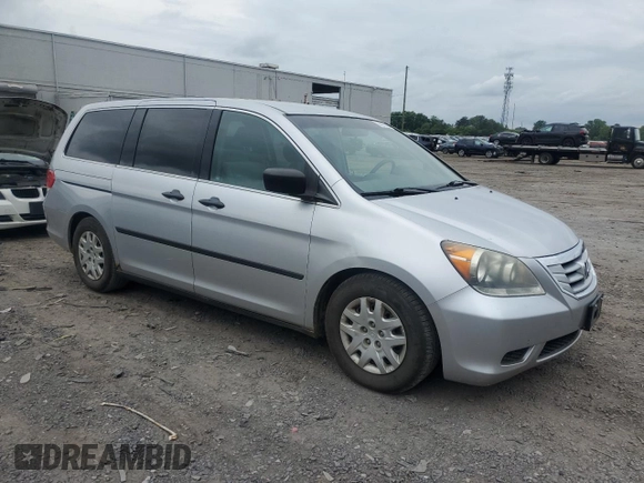 2010 Honda Odyssey LX z VIN 5FNRL3H29AB016853, wystawiony jako Copart lot #56602085 z przebiegiem 154 518 mil mil oraz Szkoda całkowita • Salvage title. Historia ofert i sprzedaży dostępna na DreamBid. Obrazek 4.