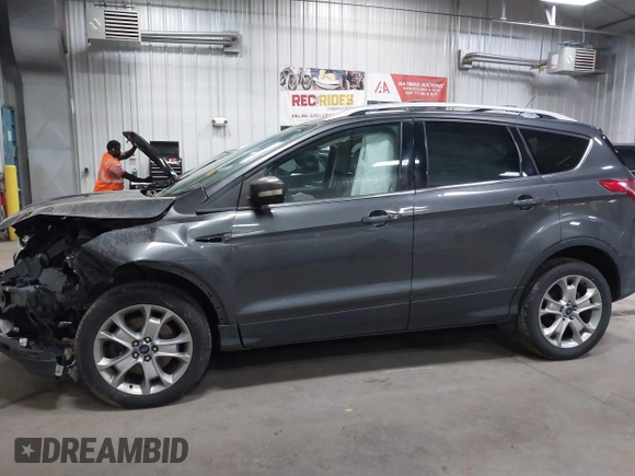 2016 Ford Escape Titanium with VIN 1FMCU9J90GUB35593, listed as a IAAI auction lot 42309020 with 173,019 mi miles and . Bid and sale history available at DreamBid. Image 14.