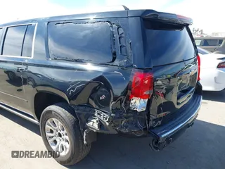 2019 Chevrolet Suburban LT with VIN 1GNSCJKCXKR332739, listed as a IAAI auction lot 41636530 with 104,997 mi miles and . Bid and sale history available at DreamBid. Image 6.