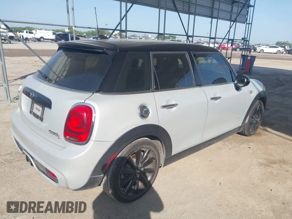 2015 MINI Hardtop 4 Door S z VIN WMWXU3C55F2B66314, wystawiony jako IAAI lot #42211312 z przebiegiem 101 395 mil mil oraz . Historia ofert i sprzedaży dostępna na DreamBid. Obrazek 4.