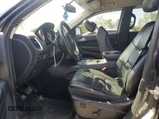 2013 Dodge Durango Crew z VIN 1C4RDHDG3DC700276, wystawiony jako Copart lot #52290215 z przebiegiem 198 243 mil mil oraz Szkody całkowita. Historia ofert i sprzedaży dostępna na DreamBid. Obrazek 7.