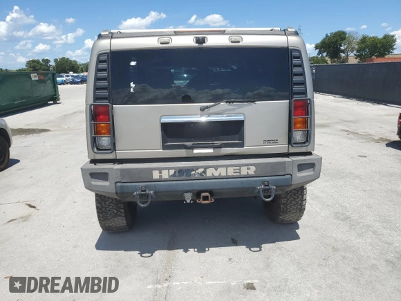 2003 Hummer H2 z VIN 5GRGN23U33H142552, wystawiony jako Copart lot #61152055 z przebiegiem Nie podano mil oraz Czysty tytuł • Clean title. Historia ofert i sprzedaży dostępna na DreamBid. Obrazek 6.