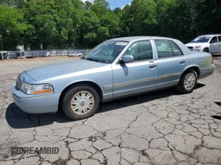 2005 Mercury Grand Marquis GS z VIN 2MEFM74W45X611002, wystawiony jako Copart lot #56645615 z przebiegiem 141 059 mil mil oraz Tytuł czysty. Historia ofert i sprzedaży dostępna na DreamBid. Obrazek 1.