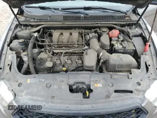 2014 Ford Taurus SE z VIN 1FAHP2D86EG143517, wystawiony jako Copart lot #51066975 z przebiegiem 134 892 mil mil oraz Szkoda całkowita • Salvage title. Historia ofert i sprzedaży dostępna na DreamBid. Obrazek 12.