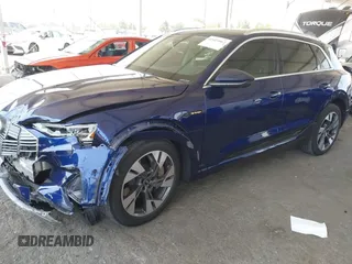 2021 Audi e-tron Premium Plus with VIN WA1LAAGE4MB038563, listed as a IAAI auction lot 42422063 with 31,645 mi miles and . Bid and sale history available at DreamBid. Image 2.