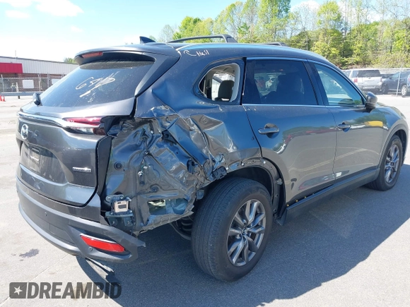 2021 Mazda CX-9 Touring with VIN JM3TCACY7M0503484, listed as a IAAI auction lot 42013262 with 63,777 mi miles and . Bid and sale history available at DreamBid. Image 6.